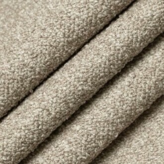 Close-up of beige textured fabric folds