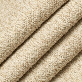 Close-up of beige textured fabric with a woven pattern