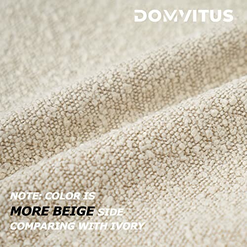 Close-up of beige textured fabric with note on color comparison to ivory.