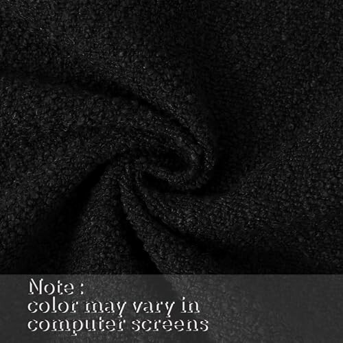 Close-up of black textured fabric with note on color variation.