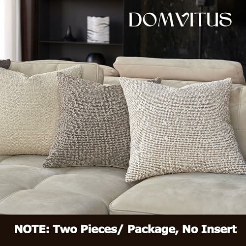 Three beige and gray textured cushion covers on a sofa.