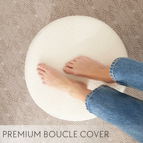 Person's feet on a round textured rug labeled 'Premium Boucle Cover'.