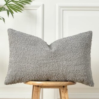 Gray textured cushion on wooden stool