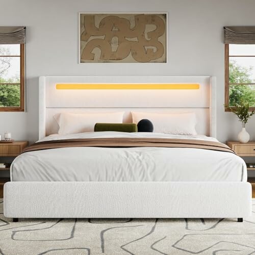 Modern bedroom with a large bed and abstract wall art.