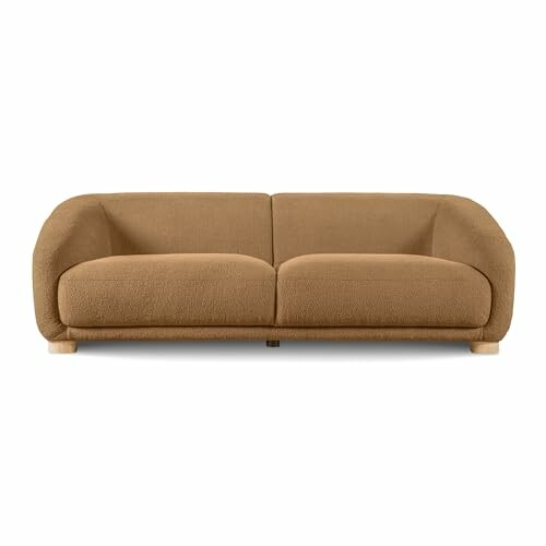 Modern brown sofa with rounded design and wooden legs, showcasing elegant craftsmanship.