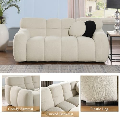 White modern sofa with comfy armrest, curved backrest, and plastic legs.