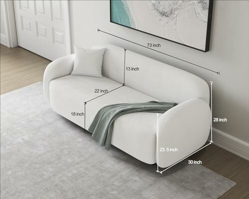 Modern white sofa with dimensions labeled, including length, width, and height.