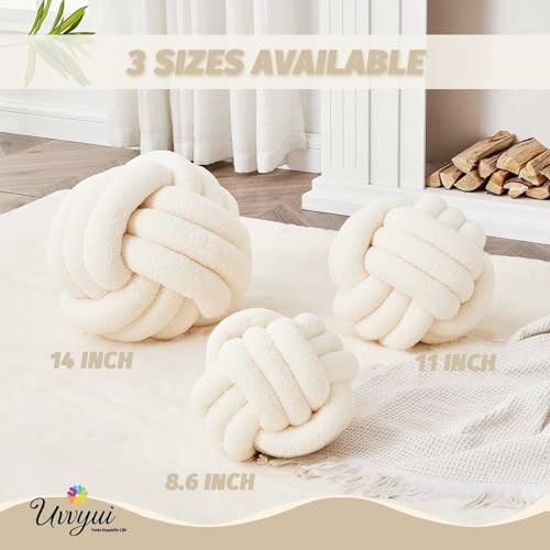 Three plush knot balls in different sizes on a cozy rug