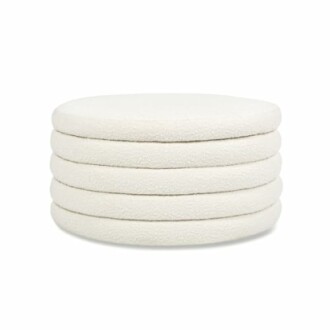 Stack of five white round cushions.