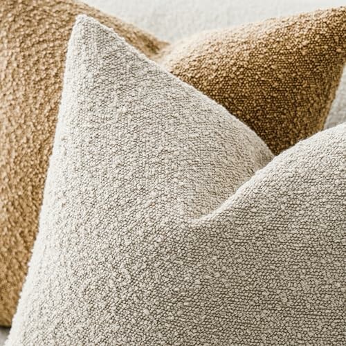 Close-up of textured throw pillows in neutral tones