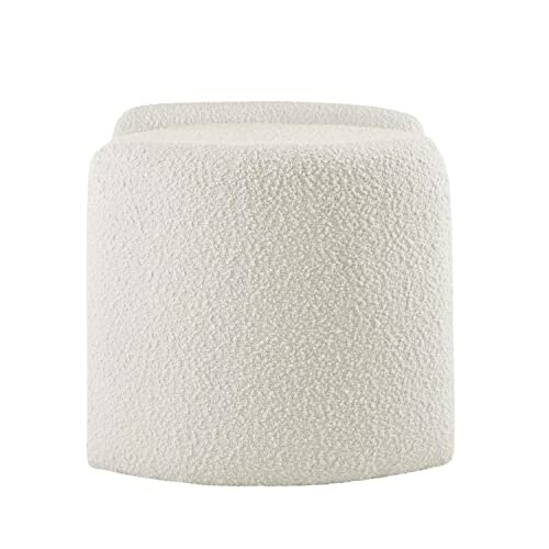 White fuzzy ottoman with a textured surface