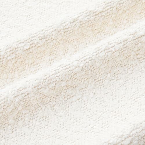 Close-up of white textured fabric with a soft pattern