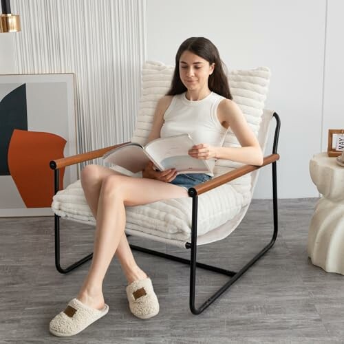 Woman sitting in a modern chair reading a book