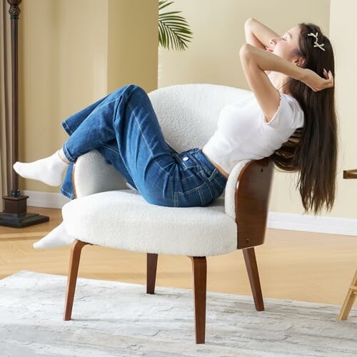 Woman in jeans and white shirt relaxing on a chair